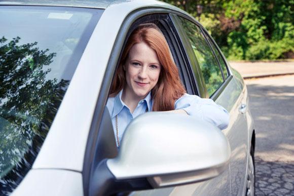 Red Haired Women Sitting in Car with Auto Insurance in Crawfordville, Havana, Monticello, Quincy, Tallahassee