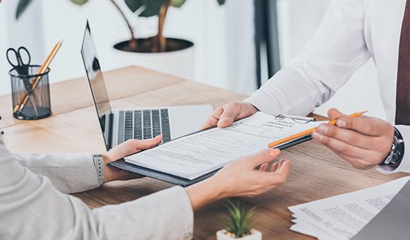 Insurance Agent & Business Owner Discussing Business Insurance Near Tallahassee, FL
