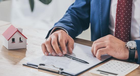 Man Signing Papers for Property Insurance in Tallahassee, FL 